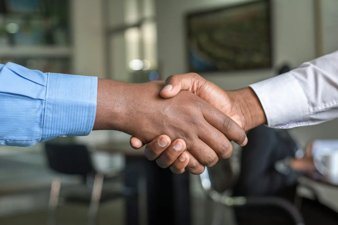 A handshake representing a successful recruitment partnership